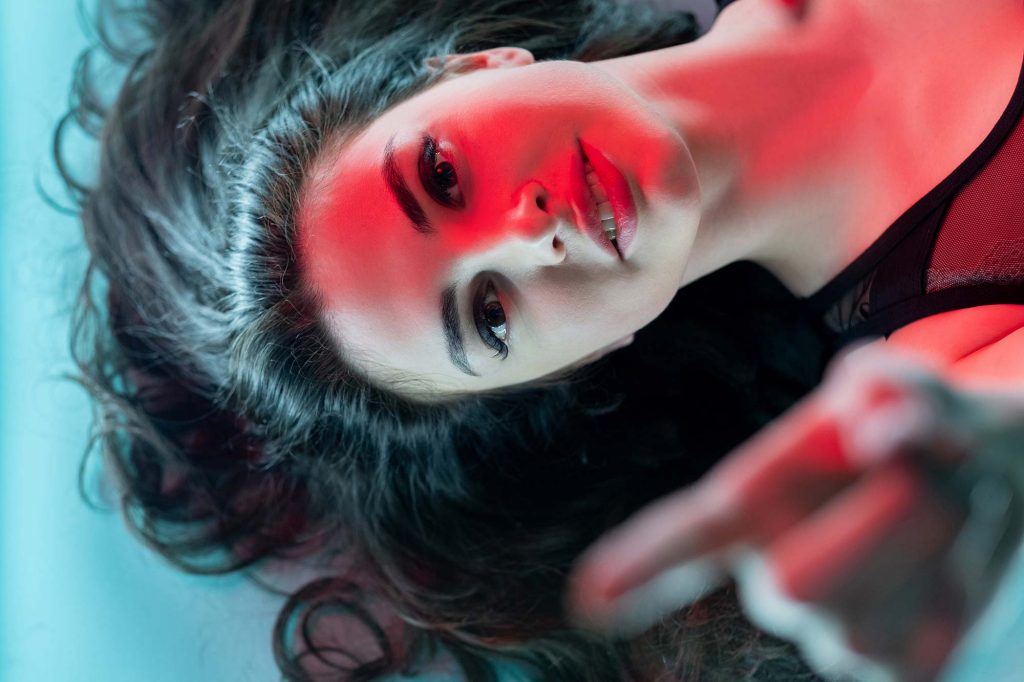 Woman under red LED light therapy treatment