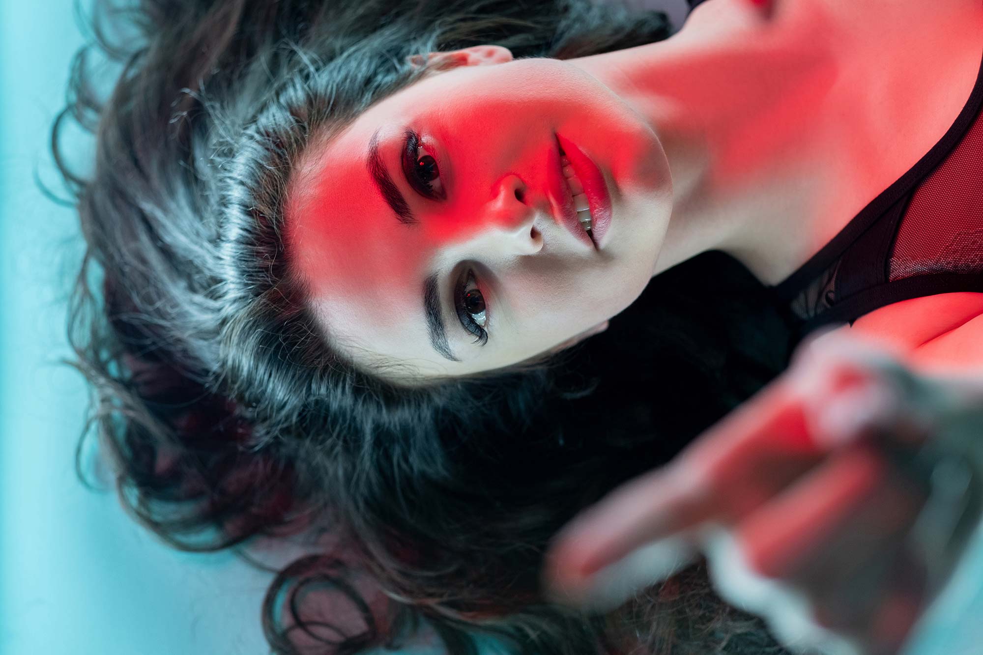 Woman under red LED light therapy treatment