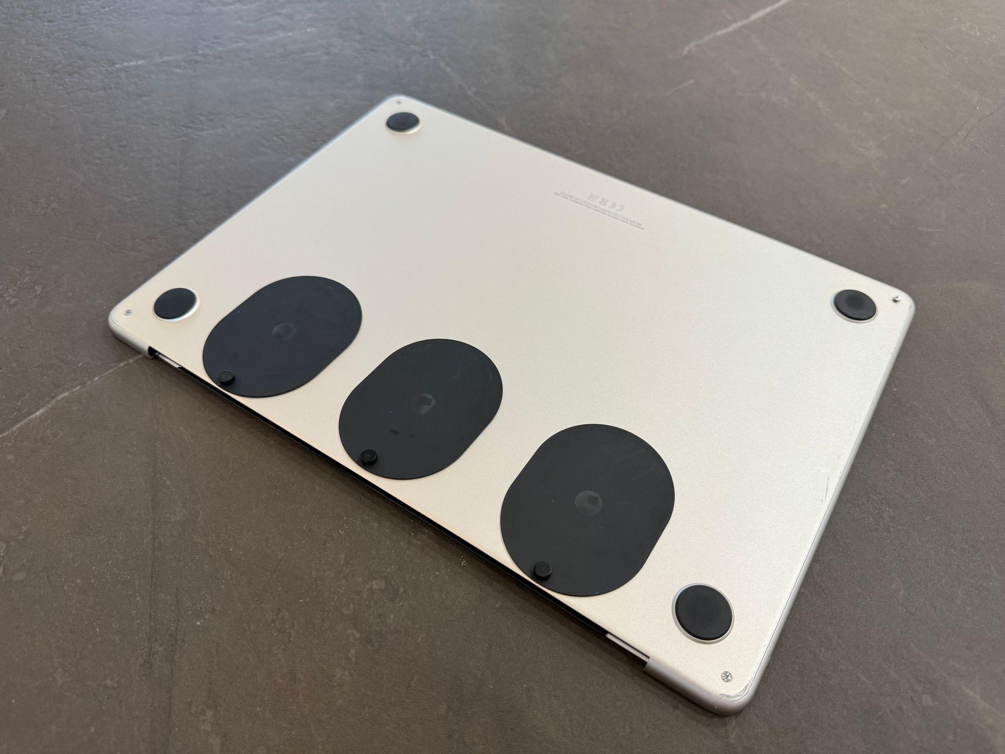 The adhesive bases I attached to the bottom of my MacBook Air.