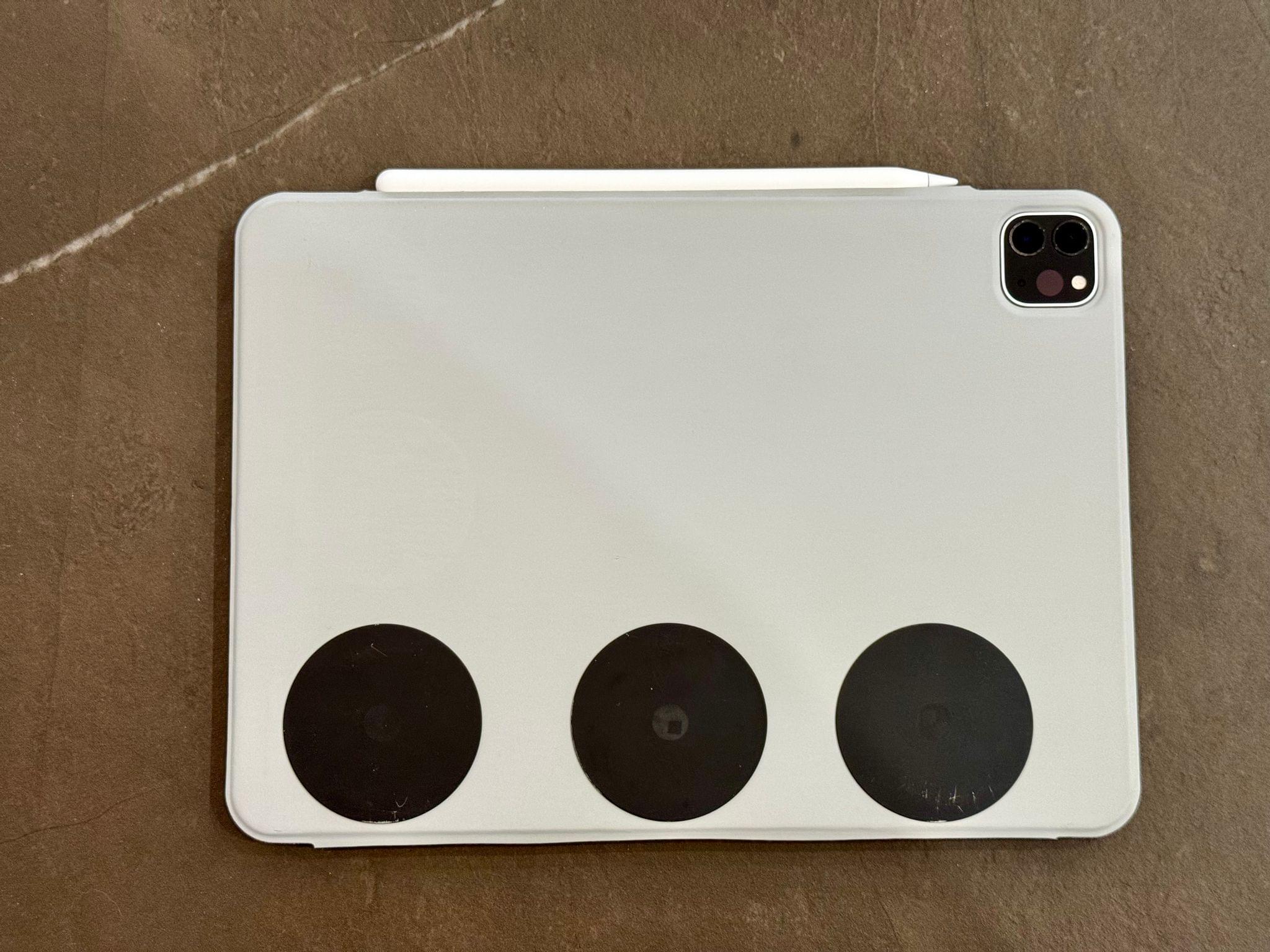 The custom back cover with magnets attached to it.