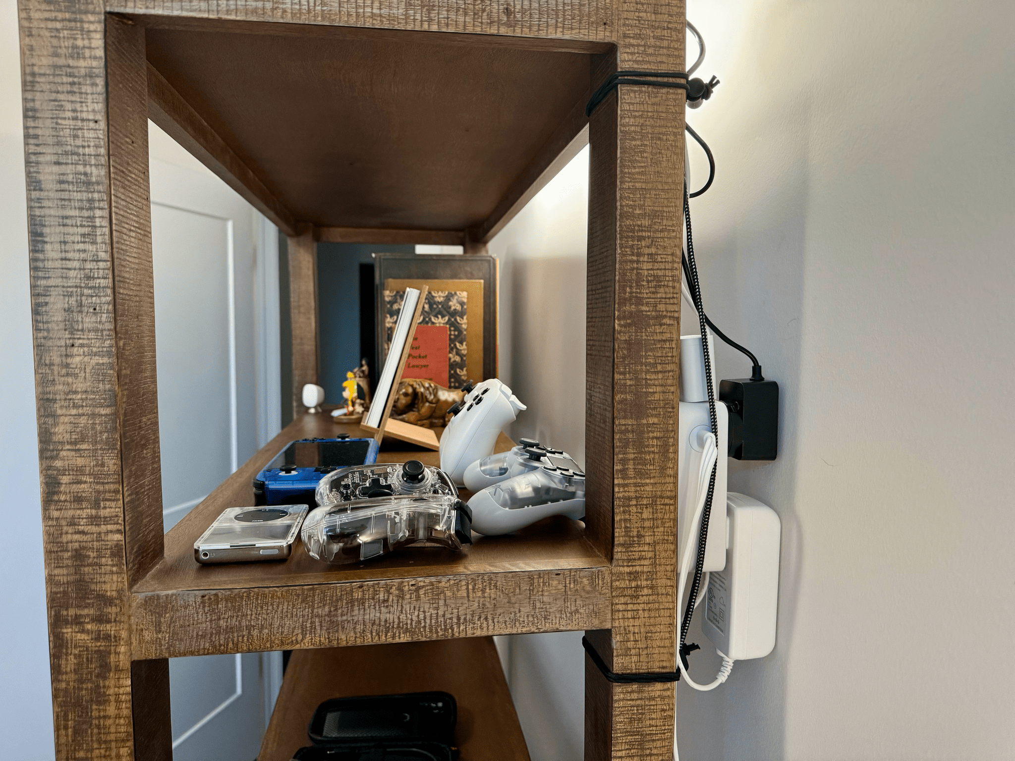 My bookcase is open, but there was just enough room to hide a small power strip and a few cables.