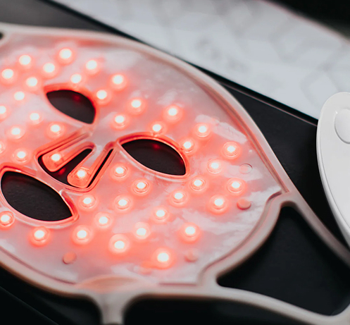 Close-up of illuminated FaceLite LED face mask