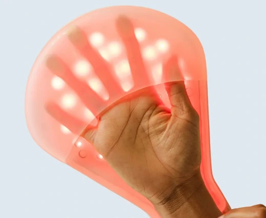 iSmart Hand LED Glove Device emitting red light for targeted skin and joint therapy