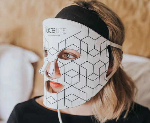 Model wearing iSmart Original LED Face Mask for at-home skin therapy