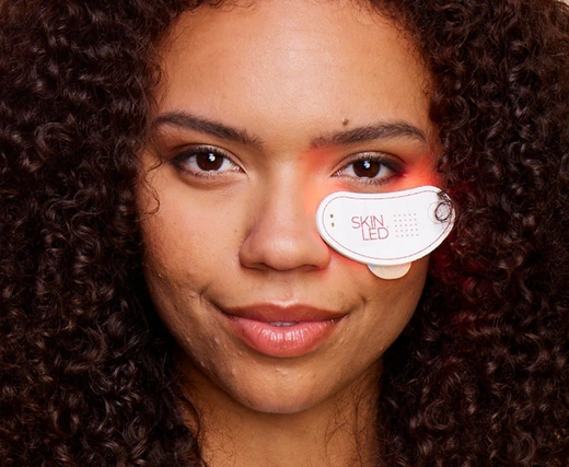 Model demonstrating iSmart Under Eye LED Patch for reducing dark circles and fine lines